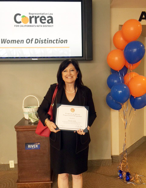 Deirdre receiving Congressman Lou Correa's Women of Distinction Award